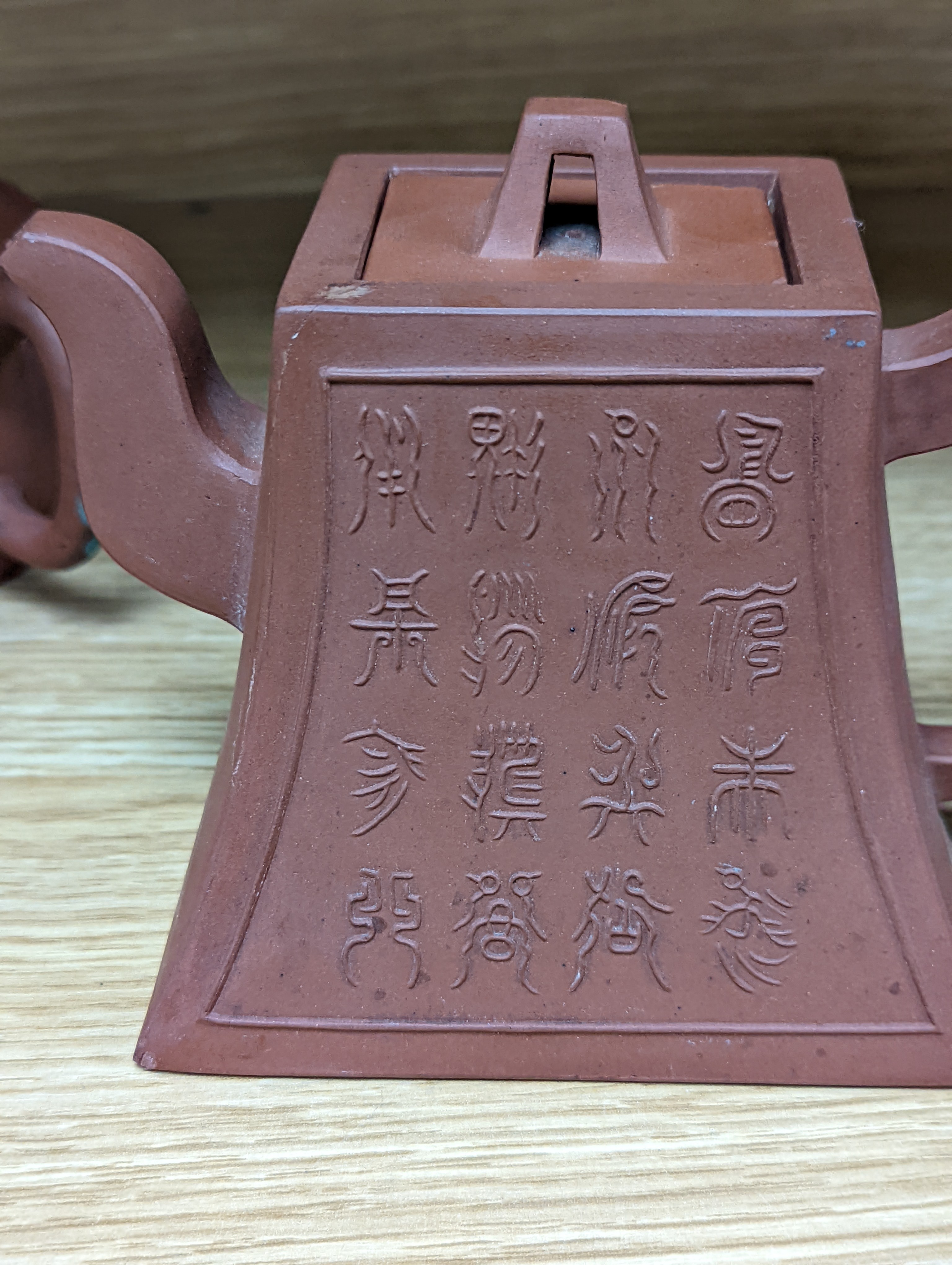 Three Chinese Yixing teapots and a carved soapstone teapot tallest 12cm